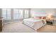 Bright main bedroom with multiple windows and neutral decor at 10222 Gemstone Ct, Parker, CO 80134