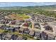 An aerial view of the home in its community with mountain views at 9807 Rosalee Peak St, Littleton, CO 80125