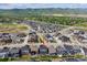 Aerial view showing the home with a manicured lawn and landscaping at 9807 Rosalee Peak St, Littleton, CO 80125