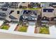 Aerial view of the house with solar panels, beautiful landscaping, and a two car garage at 9807 Rosalee Peak St, Littleton, CO 80125