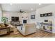 Inviting living room featuring a fireplace, comfortable seating, and stylish decor accents at 9807 Rosalee Peak St, Littleton, CO 80125