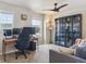 Loft area with views and a custom bookcase and comfortable seating, perfect for work or relaxation at 9807 Rosalee Peak St, Littleton, CO 80125