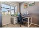 Comfortable office features a modern desk, ergonomic chair, and natural light at 9807 Rosalee Peak St, Littleton, CO 80125