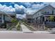 Beautiful street view showcasing charming homes and landscaped walkways, enhancing neighborhood appeal at 9807 Rosalee Peak St, Littleton, CO 80125