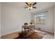 Bedroom featuring hardwood floors, a ceiling fan, and a desk space at 1439 Dexter St, Denver, CO 80220