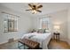 Bright bedroom with natural light, hardwood floors, ceiling fan, and modern decor at 1439 Dexter St, Denver, CO 80220