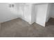 Finished basement with neutral carpeting and large closets at 4620 W Alaska Pl, Denver, CO 80219