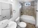 Updated bathroom with a tiled shower/tub combo and modern vanity at 4620 W Alaska Pl, Denver, CO 80219