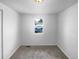 Spacious bedroom with neutral carpeting and large window at 4620 W Alaska Pl, Denver, CO 80219