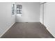 Bright bedroom featuring neutral carpeting and double closets at 4620 W Alaska Pl, Denver, CO 80219