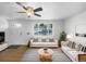 Virtually staged living room featuring hardwood floors and a neutral color scheme at 4620 W Alaska Pl, Denver, CO 80219