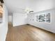 Bright living room with hardwood floors and a view of the front yard at 4620 W Alaska Pl, Denver, CO 80219