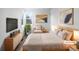 Virtually staged main bedroom with a light and airy feel at 4620 W Alaska Pl, Denver, CO 80219