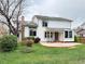 Expansive backyard featuring a large circular patio perfect for outdoor entertaining and relaxation at 8182 Sweet Water Rd, Lone Tree, CO 80124