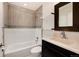 Updated bathroom featuring tub and shower combo with modern vanity at 8182 Sweet Water Rd, Lone Tree, CO 80124
