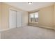 Cozy bedroom features large closet and a window at 8182 Sweet Water Rd, Lone Tree, CO 80124