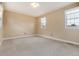 Bedroom featuring carpet and two large windows for ample light at 8182 Sweet Water Rd, Lone Tree, CO 80124