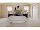 Bedroom with vaulted ceiling, neutral carpet, ample natural light, and built in storage at 8182 Sweet Water Rd, Lone Tree, CO 80124