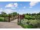 Scenic view of a pedestrian bridge surrounded by lush greenery, perfect for outdoor activities at 8182 Sweet Water Rd, Lone Tree, CO 80124