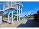 Community pool featuring a waterslide and ample deck space for lounging and recreation at 8182 Sweet Water Rd, Lone Tree, CO 80124