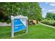 Sweetwater Park community sign surrounded by lush landscaping and walking path at 8182 Sweet Water Rd, Lone Tree, CO 80124