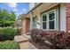 Close-up view of front entrance with well-maintained landscaping at 8182 Sweet Water Rd, Lone Tree, CO 80124