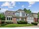 Charming home with a brick facade, well-manicured lawn, and professionally landscaped front yard at 8182 Sweet Water Rd, Lone Tree, CO 80124