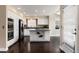 Modern kitchen with white cabinetry, stainless steel appliances, and center island, perfect for cooking and entertaining at 8182 Sweet Water Rd, Lone Tree, CO 80124