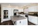 Contemporary kitchen featuring white cabinets, stainless steel appliances, and a center island with ample counter space at 8182 Sweet Water Rd, Lone Tree, CO 80124