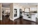 Well-equipped kitchen with white cabinets, stainless steel appliances, and a functional island for culinary enthusiasts at 8182 Sweet Water Rd, Lone Tree, CO 80124