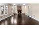 Bright living room features hardwood floors, brick fireplace, and large windows, ideal for gathering and relaxation at 8182 Sweet Water Rd, Lone Tree, CO 80124