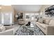 Bright living room featuring vaulted ceilings, fireplace, neutral color palette, and large windows at 8182 Sweet Water Rd, Lone Tree, CO 80124