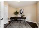 Office space featuring a large desk, neutral rug, and contemporary artwork, ideal for work or study at 8182 Sweet Water Rd, Lone Tree, CO 80124
