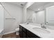 Modern bathroom featuring a double sink vanity with sleek fixtures and a tiled shower/bath combo at 14412 Heritage Dr, Mead, CO 80504
