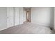 Carpeted bedroom with closet doors and a neutral color scheme, awaiting your personal touch at 14412 Heritage Dr, Mead, CO 80504
