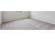 Bright, empty bedroom with neutral carpet, crisp white walls, and a sunlit window, ready for personal touches at 14412 Heritage Dr, Mead, CO 80504