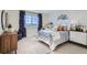 Cozy bedroom featuring a window view, comfortable bed, and unique mural at 14412 Heritage Dr, Mead, CO 80504