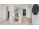 Upstairs hallway featuring neutral colors, contemporary art, and access to multiple rooms at 14412 Heritage Dr, Mead, CO 80504