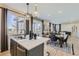 Modern kitchen island features stainless steel appliances, quartz countertops, and pendant lighting at 14412 Heritage Dr, Mead, CO 80504