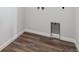 The laundry room features wood-look flooring and a washing machine hook up at 14412 Heritage Dr, Mead, CO 80504