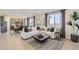 Bright, open-concept living area featuring modern decor, a cozy sectional, and lots of natural light at 14412 Heritage Dr, Mead, CO 80504