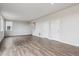 Expansive living area with modern flooring, neutral walls, staircase, and ample space for personalization at 14412 Heritage Dr, Mead, CO 80504