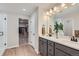 Bright bathroom features double vanity, walk-in closet, and glass enclosed shower at 14412 Heritage Dr, Mead, CO 80504