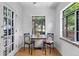 Charming breakfast nook with natural light, featuring a small table and chairs at 1040 S Elizabeth St, Denver, CO 80209