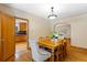 Dining room with hardwood floors, natural light, and seamless flow into the kitchen and living spaces at 1040 S Elizabeth St, Denver, CO 80209