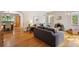 Spacious living room featuring hardwood floors, fireplace, and seamless flow into the dining area at 1040 S Elizabeth St, Denver, CO 80209