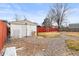 A spacious backyard featuring a shed, a fence, and gravel throughout at 838 S 10Th Ave, Brighton, CO 80601