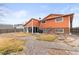 Spacious backyard with an enclosed porch, ample space for outdoor activities and entertaining at 838 S 10Th Ave, Brighton, CO 80601
