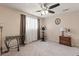 Bedroom with exercise bike, large window with natural light, and neutral carpet at 838 S 10Th Ave, Brighton, CO 80601