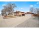 Charming two-story home with attached garage, long driveway, and landscaped front yard at 838 S 10Th Ave, Brighton, CO 80601